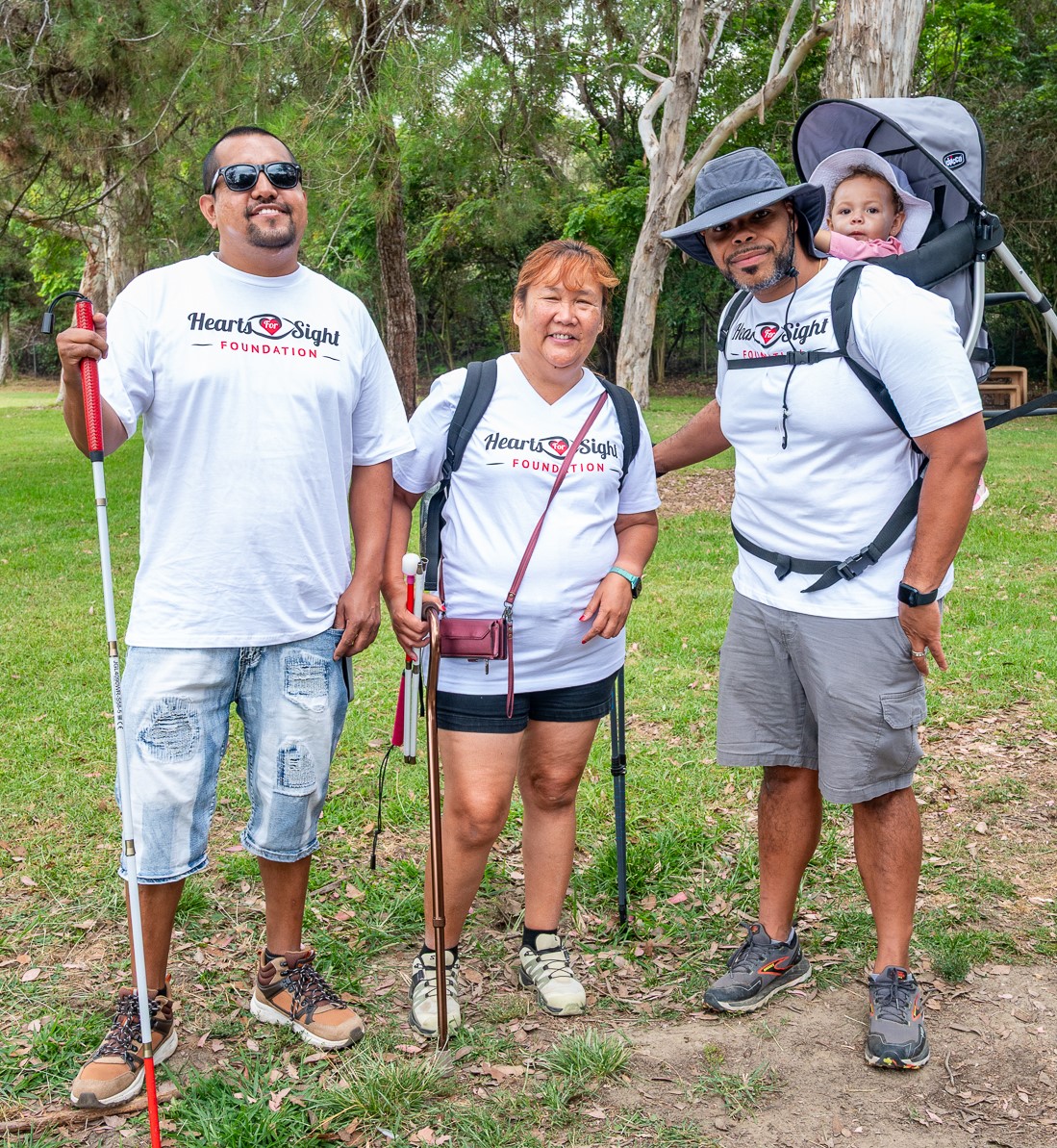 Carlos, Racquel, and Jospeh wearing the new HFS T-shirts.